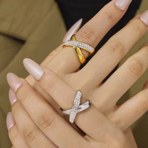 Minimalist X-shaped criss-cross rings in gold and silver finish with sparkling zircons