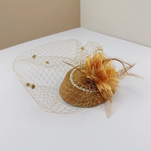 Elegant yellow fascinator hat with pearls, silk flowers and vintage polka dot mesh veil