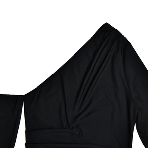Detail of black one-shoulder dress with sexy cutout and soft elastic ribbed fabric