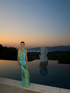 Deep V-neck halter maxi dress with green and blue marble print for beach vacations