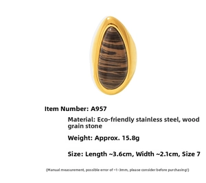 Macro detail of tear drop wood stone ring set in 18k gold plated stainless steel