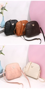 Selection of five shell cross-body bags with diamond stitching and metal butterfly detail