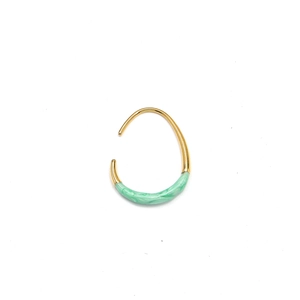 Detail of 18K gold titanium steel U-shaped hoop earring with green marble enamel finish