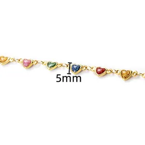 Detailed view of 5mm colorful enamel heart pendants on a gold stainless steel DIY chain