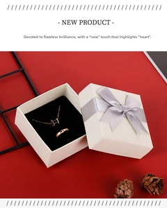 Rose gold necklace and ring set in a premium white gift box with a grey bow decoration