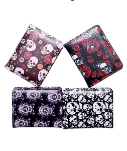 Collection of four bifold wallets featuring skull prints and smooth PU leather textures