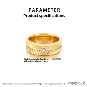 Detail of 8mm golden stainless steel ring with center rhinestone and textured surface