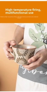 Detail of hand-held ceramic mug with vintage sunflower texture and polished beige glaze