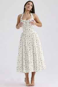 Detailed close-up of the delicate lace trim and halter neck tie on the floral summer dress