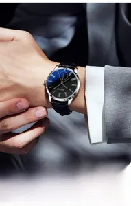 Macro detail of men's business watch featuring silver case and black Roman numeral dial