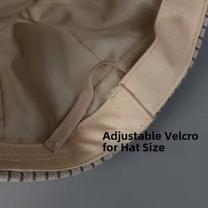 Detail of adjustable velcro strap inside the beige newsboy cap for custom head fit
