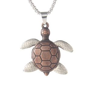 Vintage sea turtle pendant necklace in antique bronze and silver finish on white background