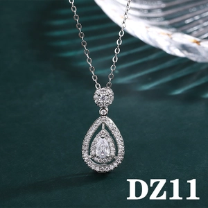 Detail view of double-layered teardrop pendant necklace with sparkling cubic zirconia stones