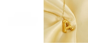 Close-up of 3D bubble letter A pendant in 18K gold plating with lead and nickel free finish
