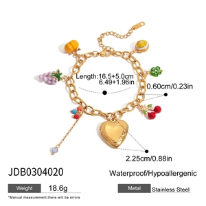 Detail of 18K gold plated stainless steel bracelet with colorful fruit enamel charms