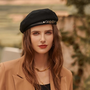 Classic black beret with decorative leather strap and gold star metal accessories