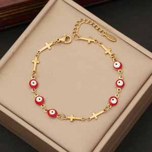 Golden stainless steel bracelet with red evil eye beads and small crosses jewelry