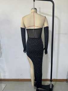 Detail of elegant black mesh evening dress with silver rhinestones and matching long gloves