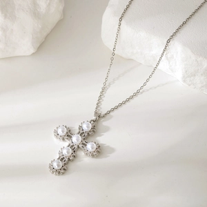 Luxurious geometric cross pendant necklace with white pearls and sparkling zircons