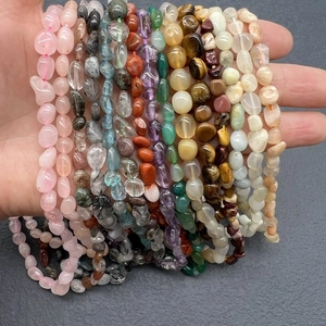 Detailed close-up of natural irregular gemstone beads featuring rose quartz and amethyst