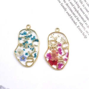 Face profile resin charms with dried flowers in gold metal frame for DIY jewelry