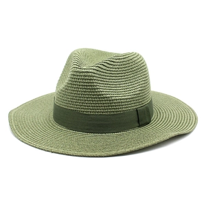 Close-up of olive green straw fedora hat featuring breathable woven texture and ribbon