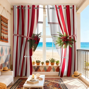 Detail of red and white striped velvet curtains with festive berry tiebacks by the sea