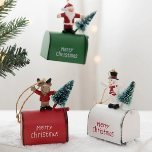 Festive Christmas mailbox ornaments with Santa, reindeer, and snowman figurines