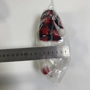 Detail view of a 15cm Christmas gnome doll with ruler for size measurement