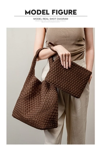 Close-up of brown woven tote bag set with intricate intrecciato leather craftsmanship