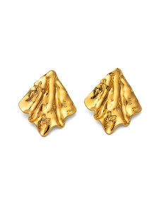 Detailed view of irregular pleated gold earrings with a natural crinkled metal texture