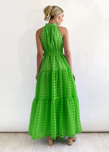 Detailed back view of a tiered green plaid maxi dress with an elegant halter neckline