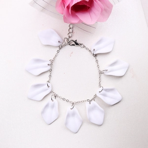 Detail of silver chain bracelet with white petal charms and lobster clasp closure