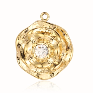 Detailed view of a gold rose pendant featuring a central crystal and hammered texture
