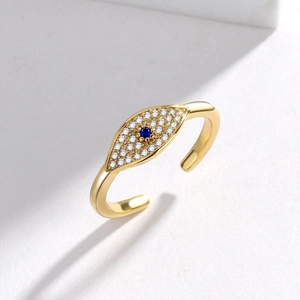 Gold Evil Eye adjustable ring with blue sapphire center stone and white crystals
