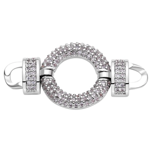 Close-up of a silver circular jewelry clasp with pavé-set zircons and secure connectors