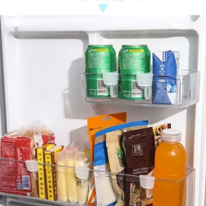 Close-up of clear adjustable refrigerator side door dividers for organizing small food items