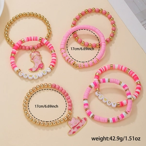 Detailed view of pink western bracelets set with Cowgirl letter beads and boot charms