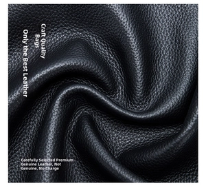 Close-up of black genuine lychee grain leather texture with natural soft finish