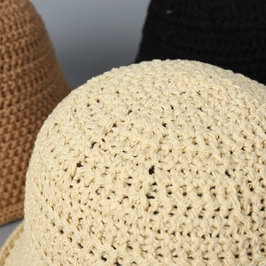 Hollow knit bucket hats in beige, brown, and black with breathable crochet texture