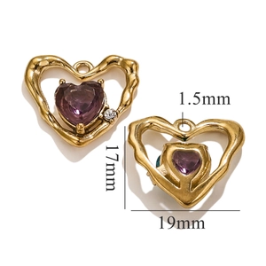 Detailed macro view of heart-shaped gold charm with purple crystal and size dimensions