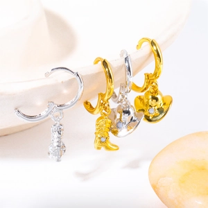 Western cowboy style hoop earrings with gold boot and silver hat charms featuring blue gems