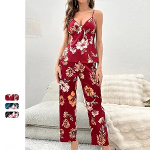 Women's burgundy floral satin pajama set with camisole top and straight-leg trousers
