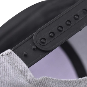 Detail of the adjustable plastic snapback closure on a grey cotton baseball cap