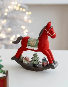 Detail of red Christmas rocking horse ornament with resin knit texture and festive glitter