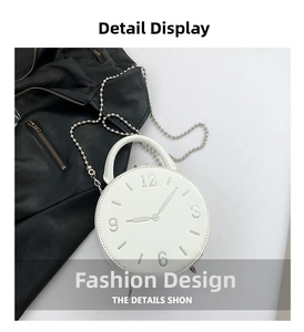 Close-up of white round clock-face handbag with embossed numerals and silver chain