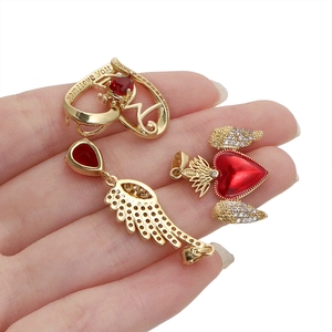 18K gold plated wing and heart pendants set with red stones and Mom I love you engraving