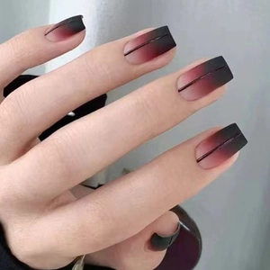 Square matte press-on nails featuring black and red gradient with fine line detail