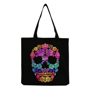Detail of the vibrant floral skull print on a large black canvas tote bag for storage