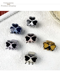 Detailed set of mini clover hair clips with colorful rhinestones in multiple colors